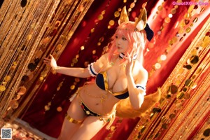 A woman in a bikini with a fox tail on her back.
