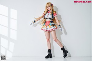 A woman in a maid outfit posing for a picture.
