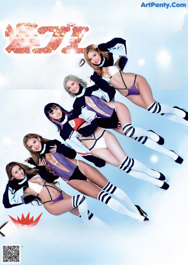 A group of young women in cheerleading uniforms posing for a magazine.