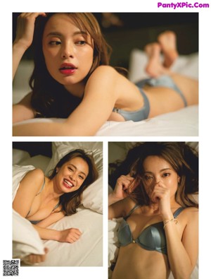 A woman laying on top of a bed holding a cell phone.