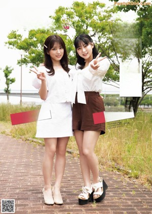 A magazine page with a picture of two young women sitting on a bench.