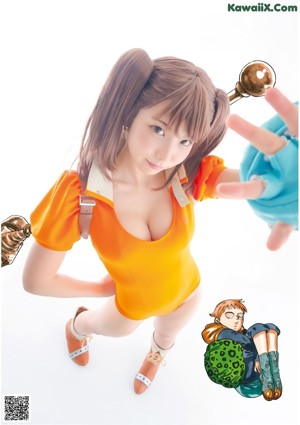 A woman in a pink shirt and blue skirt holding a sword.