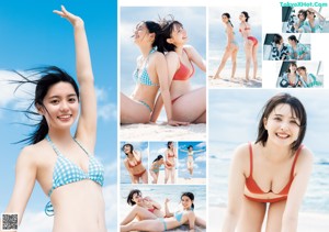 A couple of women sitting on top of a sandy beach.