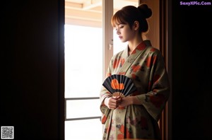 A naked woman standing in a hallway next to a window.