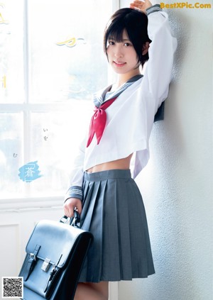 A woman in a white lingerie posing for a magazine.