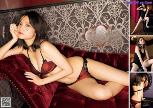A woman in lingerie looking at herself in the mirror.